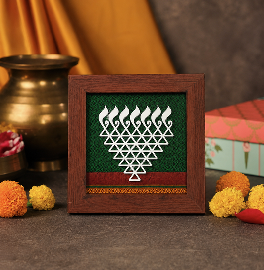 Decorative frame with a geometric design on a table with decorative items.